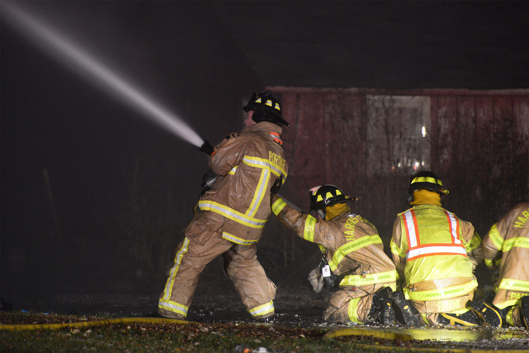 Spot News - 2nd place - Firefighters battle a house fire at 15645 W. True Road in Graytown. (Molly Corfman / The News-Messenger)