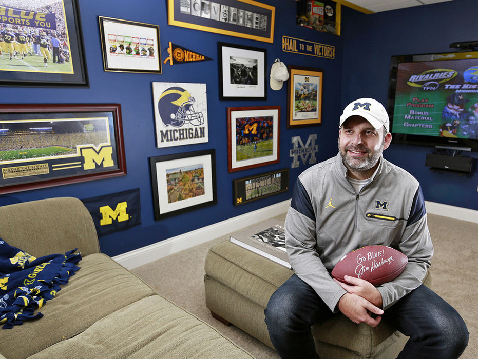 Portrait - 1st place - Brad Paskievich of New Albany is photographed in his Michigan Wolverine-themed "Man Cave."  (Barbara J. Perenic / The Columbus Dispatch)