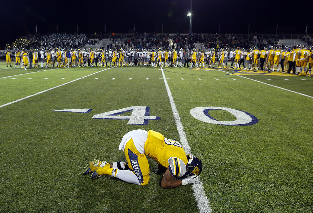 Sports Feature - 1st place - Toledo Whitmer High School player Shoe Sanders reacts after the Panthers season ending loss to Medina High School during their Division I playoff game at Whitmer High School. (Andy Morrison / The (Toledo) Blade)