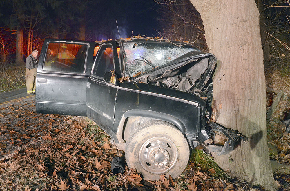 Spot News - 2nd place - A pickup truck rests against a tree off Waterford Road in Unity Township after an accident just after midnight killing one teen and injuring two others. (Patricia Schaeffer / The (Lisbon) Morning Journal)