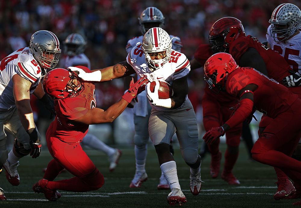 Sports - 2nd place - Ohio State running back Mike Weber (25) gets past Maryland defensive back Alvin Hill (27) during the first half at Maryland Stadium in College Park, Md.  (Kyle Robertson / The Columbus Dispatch)