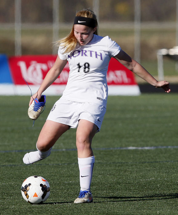 SPSports - HM - Pickerington North's Camryn Dees kicks the ball downfield barefoot after losing her cleat during a Division I regional finals match at Hilliard Bradley High School. Pickerington North went on to defeat Gahanna Lincoln, 1-0, advancing to the Division I state semifinals. (Shane Flanigan / ThisWeek Newspapers)