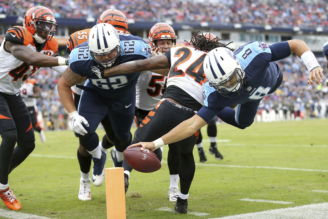 SSports - 2nd place - Tennessee Titans quarterback Marcus Mariota (8) dives for the end zone in the second quarter against the Cincinnati Bengals at Nissan Stadium in Nashville. (Kareem Elgazzar / Cincinnati Enquirer)