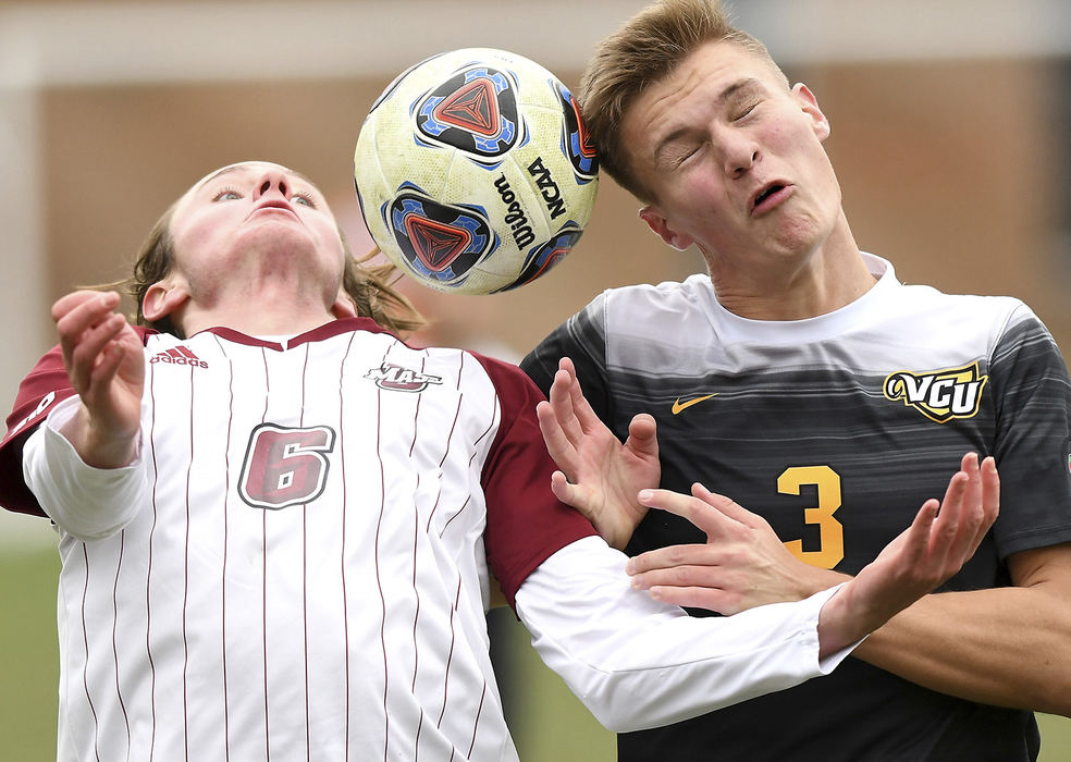 Sports - 3rd place - UMass's Davis Smith and Ulrik Edvarson of VCU battle for control of the ball during the Atlantic 10 conference championship match at Baujan field on the campus of the University of Dayton. UMass defeated VCU 3-1 to clinch the title and earn an automatic bid to the NCAA Tournament.  (Erik Schelkun / Elsestar Images)