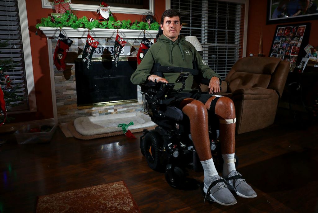 Portrait - 2nd place - Ryan Custer, 23, at home in Green Township suffered a critical spinal cord injury three years ago while playing basketball at Wright State University. Custer’s story will be featured in an upcoming documentary, Ending Disease, that highlights Custer’s positive outlook. Kareem Elgazzar / The Cincinnati Enquirer