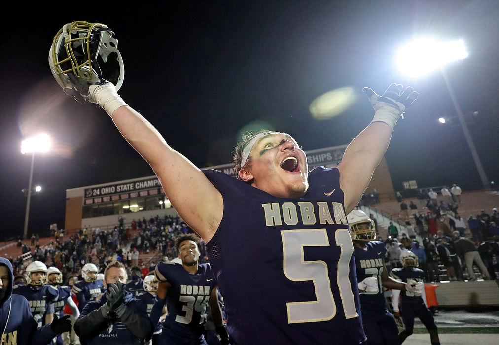 Sports Feature - HM - Hoban lineman Luke Petit celebrates after the Knights beat Massillon, 35-6, in the Division II state championship game in Massillon. Jeff Lange / Akron Beacon Journal