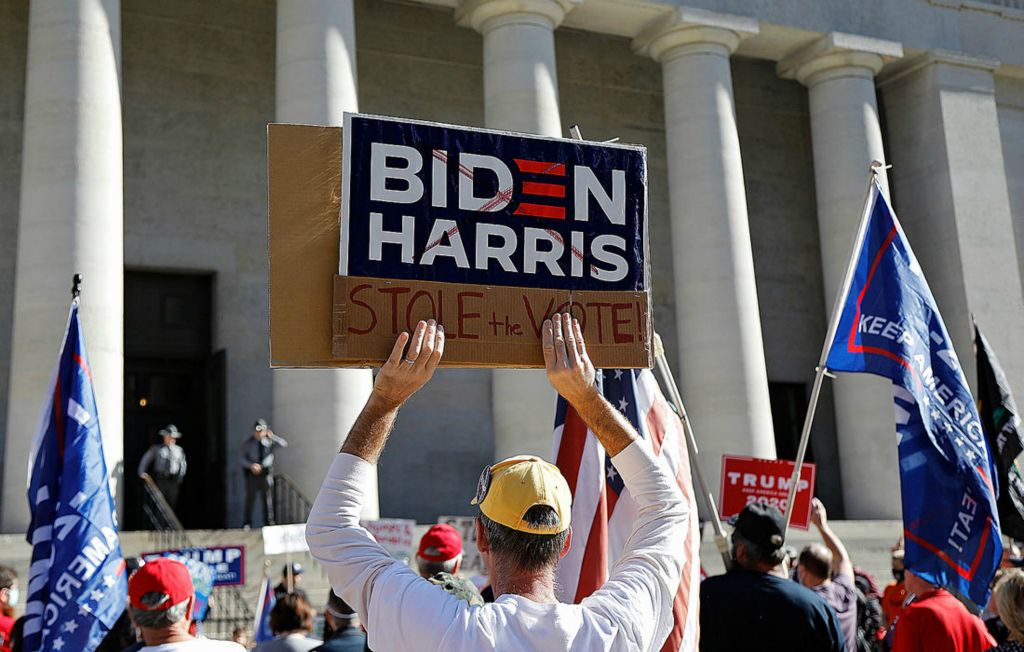 Story - 1st place - Trump supporters cheer "stop the steal" during a rally at the Ohio Statehouse in Columbus. Democrat Joe Biden was projected to become the president-elect of the United States on Saturday morning.  Kyle Robertson / The Columbus Dispatch