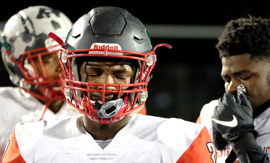 Sports Feature - HM - Central Catholic's Dahveyon Greer (32) sheds tears after the team's 35-21 loss in a Division II state football semifinal game against Cincinnati La Salle hosted at Sidney High School. (Kurt Steiss / The Blade)