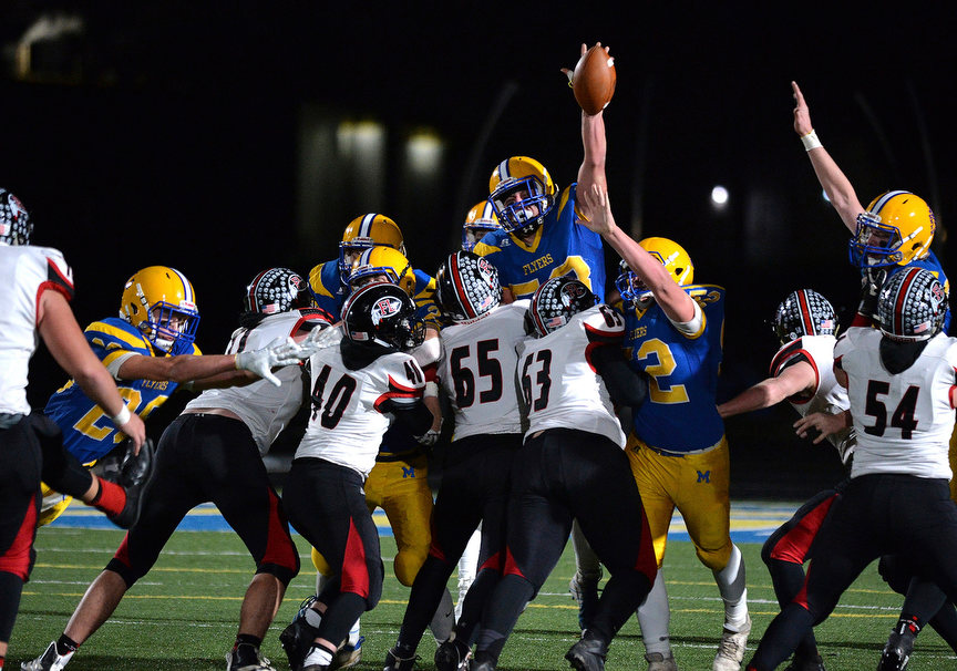 Sports - 3rd place - Marion Local's Matt Everman (58) blocks Fort Loramie's Mack Fortman's (78) field goal attempt in the second half of a Division VII regional semifinal game at Grand Lake Health System Field in St. Marys. Marion Local defeated Fort Loramie, 24-21, in overtime. (Daniel Melograna / The Daily Standard)