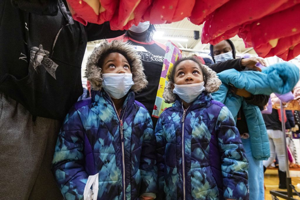 General News - 3rd place - Anaja Reynolds (left) and her twin sister Alaja pick out their winter coats during Susie’s Coats annual distribution of coats and warm weather essentials at Jones Leadership Academy of Business in Toledo.(Rebecca Benson / The Blade)