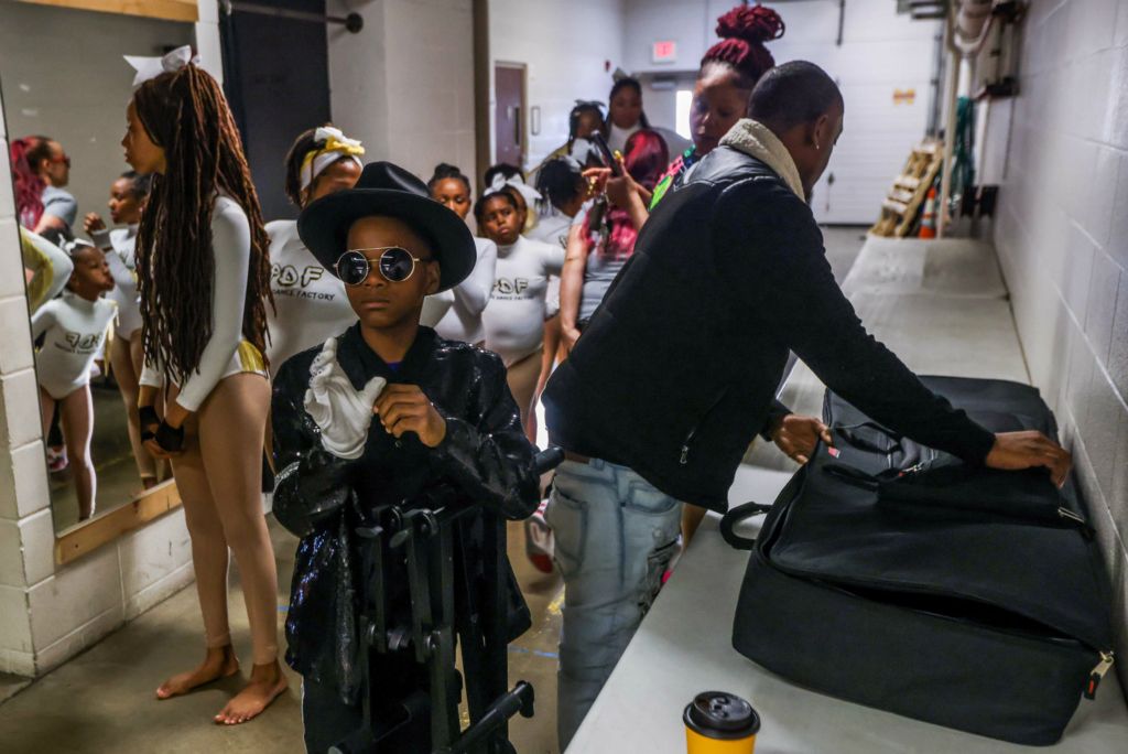 Feature - 3rd place - Toledo resident Gregory Buchanan, 12, adjusts his bedazzled glove backstage before performing “Thriller” by Michael Jackson during a talent show at Maumee Indoor Theatre in Maumee.  (Isaac Ritchey / The Blade)