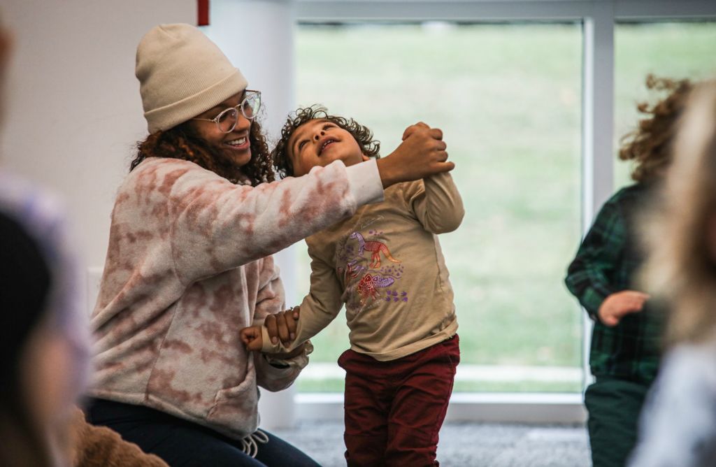 Feature - HM - Carriene Kusz (left) dances with Quincy Kusz, 2, during the Preschool Dance Party event at King  Road Branch Library in Sylvania. (Lizzie Heintz / The Blade)