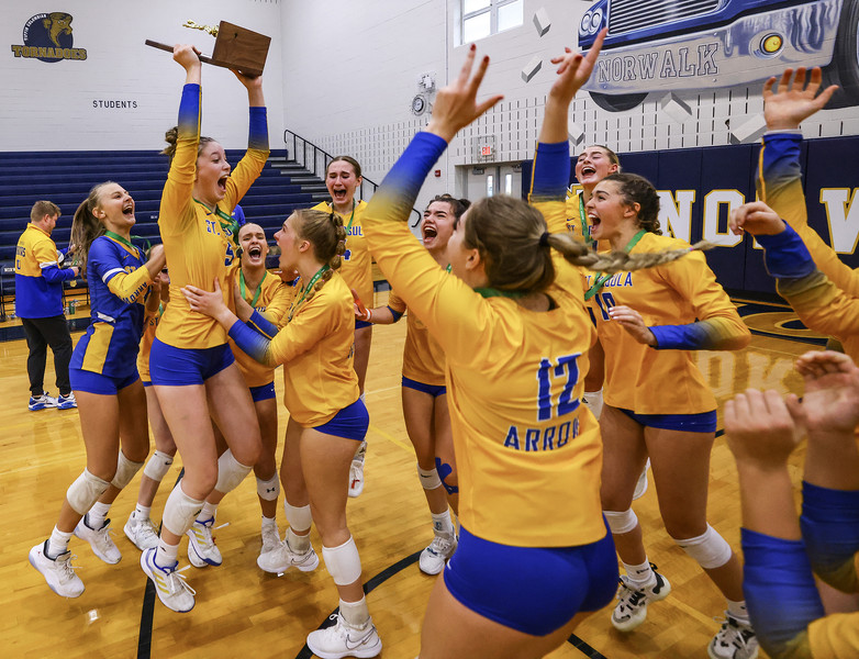 Sports Feature - 1st place - St. Ursula players celebrate defeating Avon to win the Division I regional volleyball final at Norwalk High School. St. Ursula defeated Avon 3 sets to 1.  (Jeremy Wadsworth / The Blade)