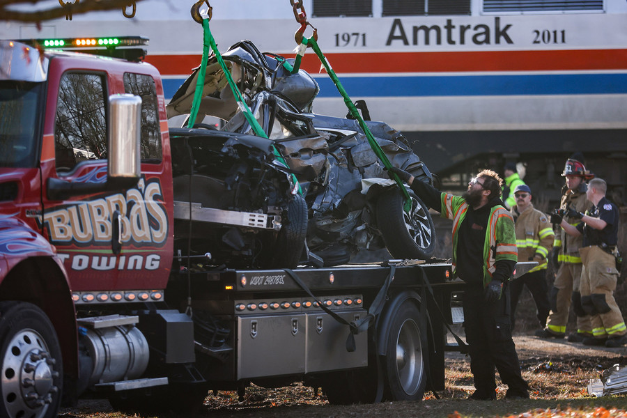 Spot News - 2nd place - First responders work to clear the scene of a car that was struck by an Amtrak train in Holland.  (Rebecca Benson / The Blade)