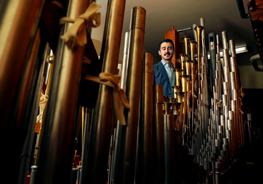 Portrait - 1st place - Curator Christopher Ha is framed by some of the Wurlitzer organ pipes that he and other volunteers removed for an emergency roof repair at the Akron Civic Theatre. The Wurlitzer organ will be played for the first time since 2021 during Ballet Theater of Ohio’s performances of “The Nutcracker” (Jeff Lange / Akron Beacon Journal)