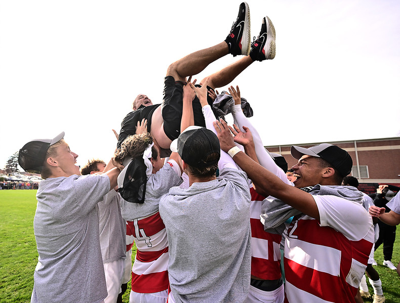 Sports Feature - 1st place - Dayton's Head Coach Dennis Currier gets tossed in the air in celebration after the Dayton Flyers defeated Saint Louis 3-0 to win the Atlantic 10 championship. (Erik Schelkun / Elsestar Images)