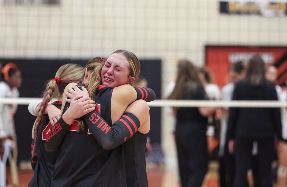 Sports Feature - HM - Bedford’s  Raegan VanEckhoutte and Kadence Esser hug  after Bedford’s loss to Northville in the MHSAA Division 1 state quarterfinal high school volleyball match at Dearborn High School in Dearborn, Michigan. Northville defeated Bedford, 3-0. (Rebecca Benson / The Blade)