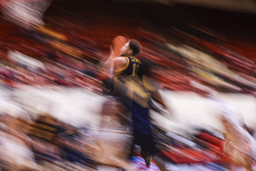 Sports - 3rd place - Toledo’s Sam Lewis drives to the basket during a men’s college basketball game at Calihan Hall in Detroit, Mich., on Saturday, November 16, 2024.  (Rebecca Benson / The Blade)