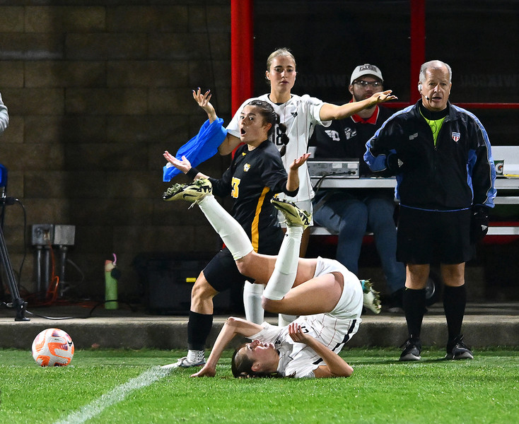 Sports - HM - Dayton's Kyra Karfonta gets rolled upside down by VCU's Stella Castro during the Atlantic 10 quarterfinal match at Baujan Field in Dayton. Dayton defeated VCU 1-0 to advance to the next round of the tournament (Erik Schelkun / Elsestar Images)