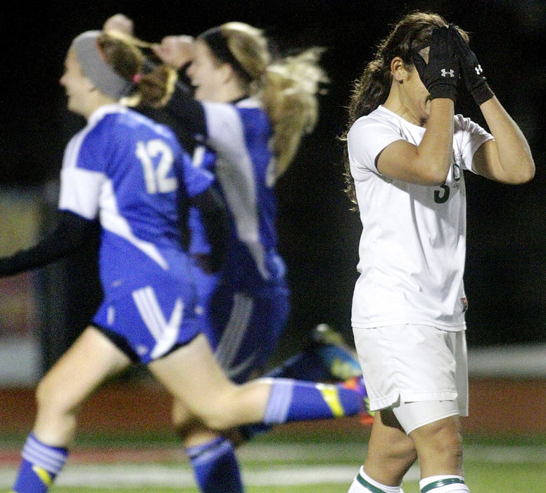 Sports - 1st place - Nicky Shouvlin of Catholic Central reacts after missing a penalty kick, sealing a 4-3 loss to Miami East in the Division III district championship girls soccer match at Wayne High School. (Barbara J. Perenic / Springfield News-Sun)