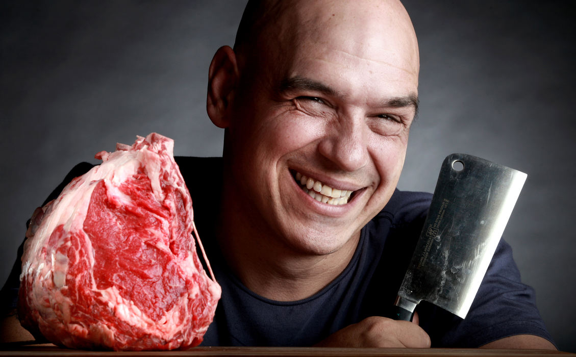 Portrait - 1st placeCelebrity Chef Michael Symon has a new book coming out called "Carnivore". He is pictured here with a piece of raw meat, a standing rib roast. (Lisa DeJong / The Plain Dealer)