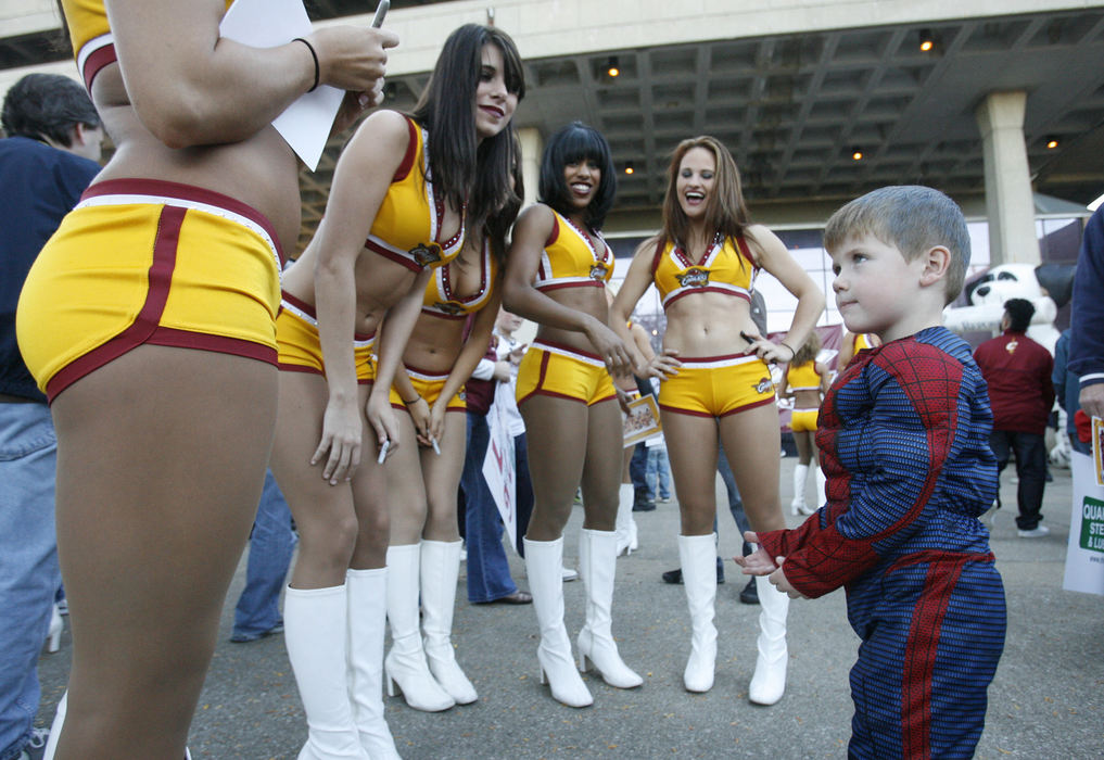 Sports Feature - 2nd placeColton Butler, 4, of Plain Township dressed as Spider Man as he got to know the Cavaliers Girls outside the Canton Civic Center prior to the Cavaliers preseason game with the Milwaukee Bucks. (Scott Heckel / The Repository)