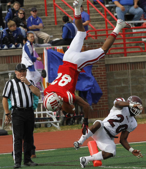 Sports - 1st placeDesi Kirkman, (82) of Wittenberg somersaults over Mychael Gilliam (20) of Chicago for a touchdown at Edwards-Maurer Field in Springfield. A video of the flipping Kirkman later graced the number two spot of ESPN's Top Plays. (Barbara J. Perenic / Springfield News-Sun)