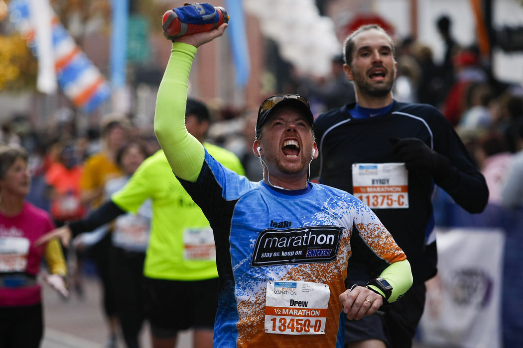 Story - 3rd placeHalf-marathon runner Drew Glenn, of Reynoldsburg, reacts as he crosses the finish line during the Columbus Marathon. Glenn ran the half-marathon in 1:57:33.  (Eamon Queeney / The Columbus Dispatch)