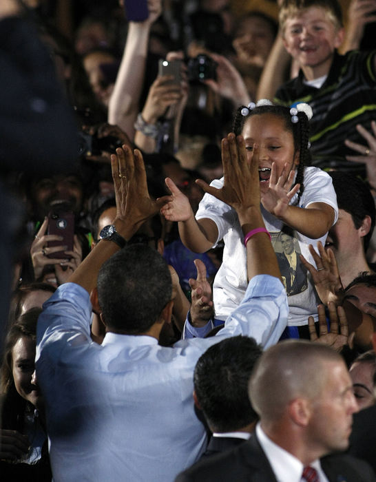 Story - HMPresident Barack Obama greets the crowd after speaking to 14,000 people on the Ohio University campus in Athens. (Jonathan Quilter / The Columbus Dispatch)