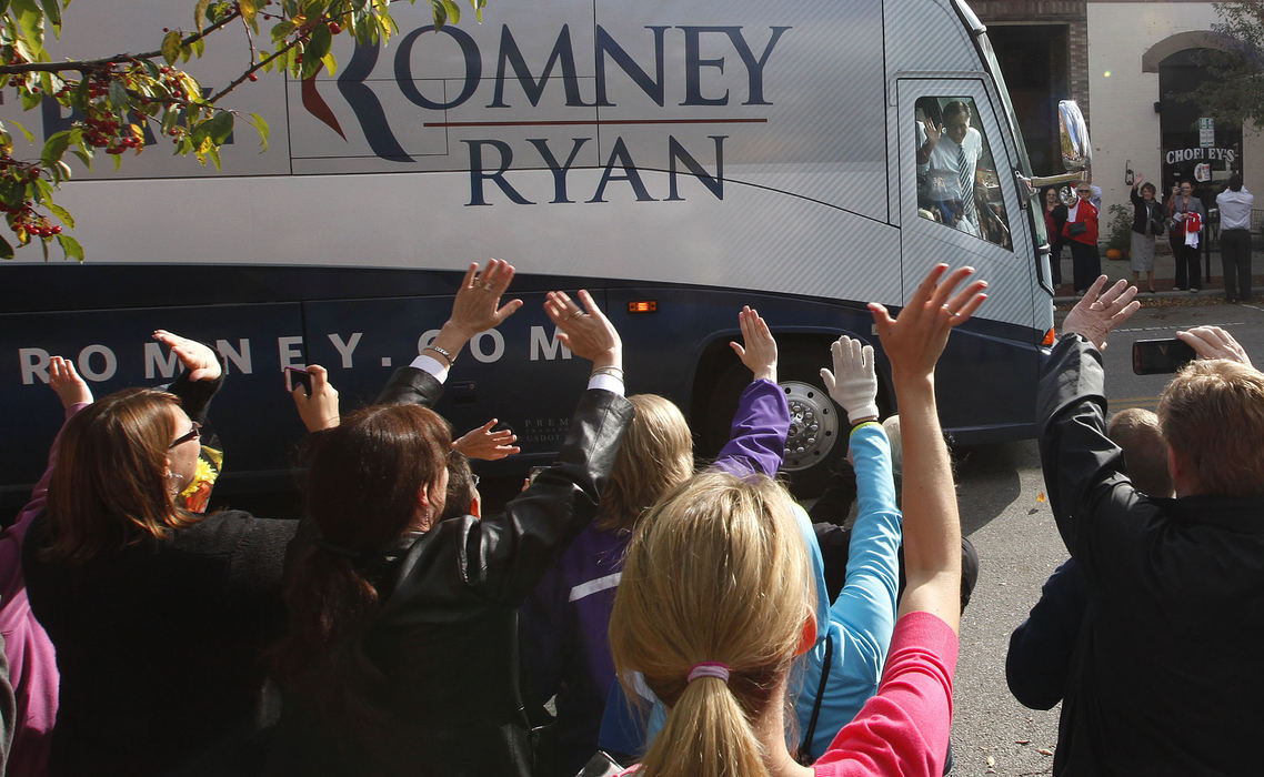 Story - HMRepublican Mitt Romney waves from his campaign bus after giving his remarks at Bun's Restaurant in Delaware. (Jonathan Quilter / The Columbus Dispatch)