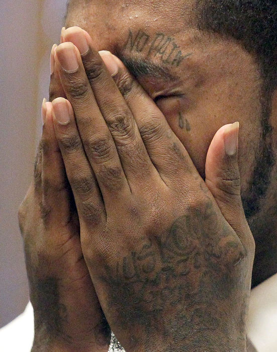 General News - 1st placeJohnnl Lewis wipes away tears  during victim impact statements. Lewis  plead guilty and was sentenced by Judge Allison McCarty for the shooting death of McDonald's worker John Lehman in Akron.  (Phil Masturzo / Akron Beacon Journal)