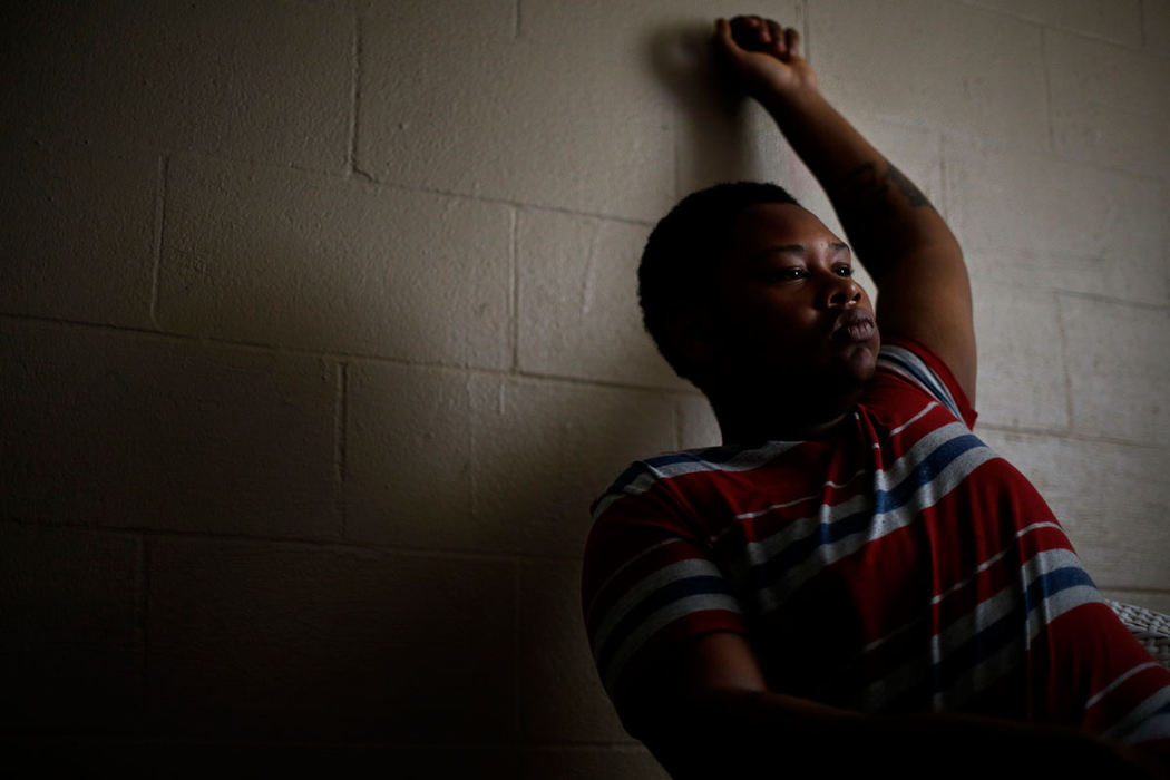 Portrait - 1st placeAntwan Milton, 15, talks to Dispatch reporters in the basement of the North Linden home he lives in with his cousin and other family members. Milton was shot in the basement of his uncle's home but wont tell how it happened. The bullet went through his left wrist and lodged in his skull, doctors say it will eventually come out on it's own. “I was just sitting in the living room, (and) the gun went off,” he said. “I don’t know who did it.”  (Eamon Queeney / The Columbus Dispatch)