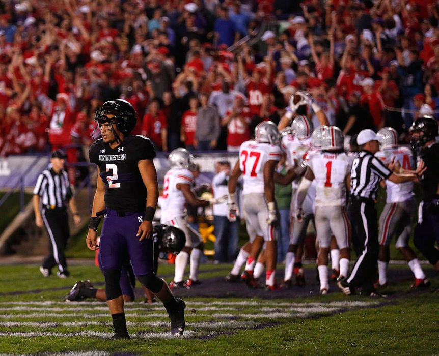 Sports Feature - 1st placeNorthwestern Wildcats quarterback Kain Colter (2) walks away after Ohio State recovered a fumble in the end zone to end the game during the second half at Ryan Field in Evanston, Illinois. (Jonathan Quilter / The Columbus Dispatch)