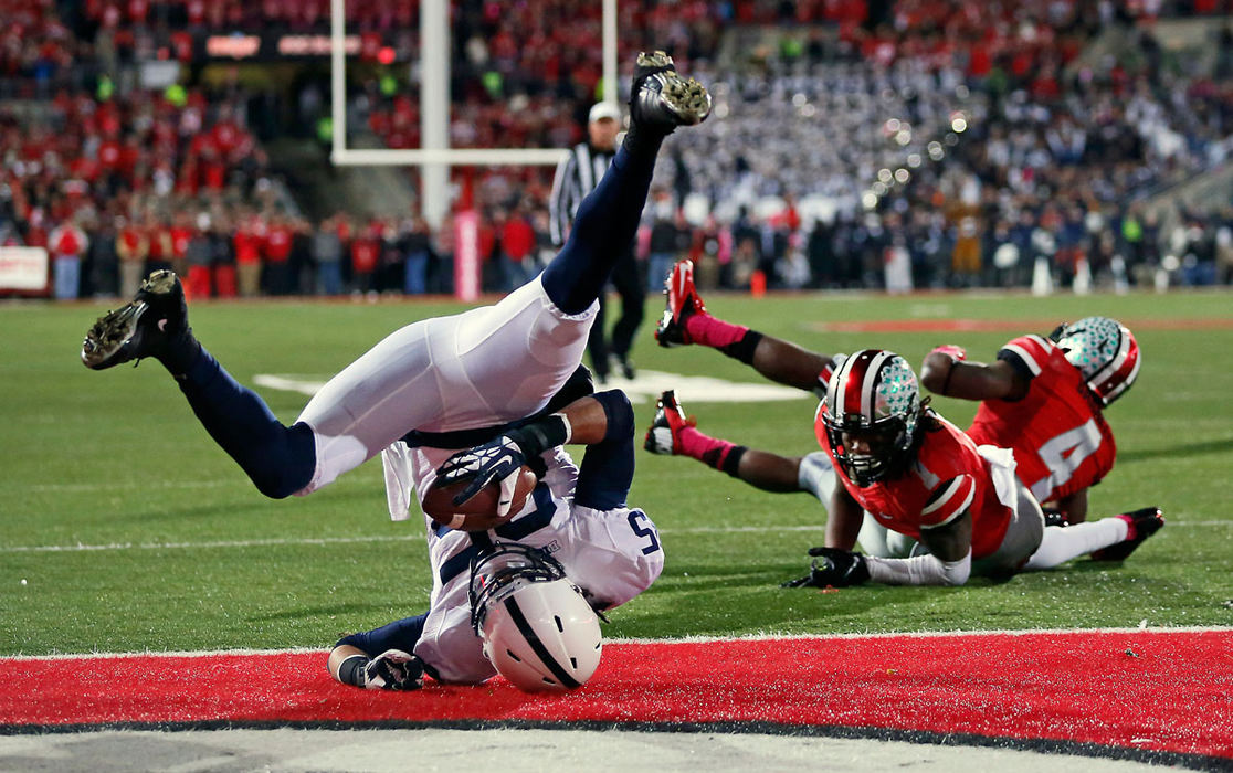 Sports - 2nd placePenn State wide receiver Brandon Felder (85) catches a touchdown behind Ohio State cornerback Bradley Roby (1) and safety C.J. Barnett (4) during the first half of a game at Ohio Stadium in Columbus. (Adam Cairns / The Columbus Dispatch)