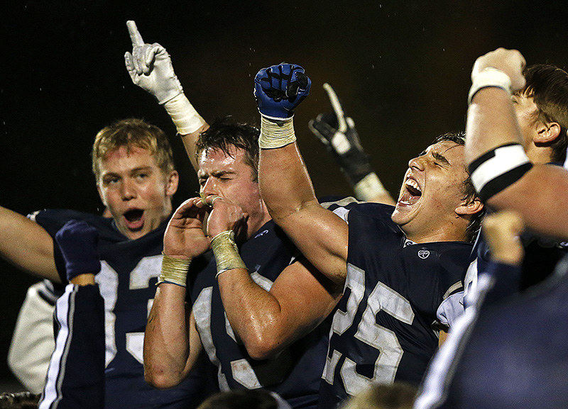 Sports Feature - 1st place - The Granville Blue Aces face the crowd, reacting wildly in celebration, after edging Licking Heights 26-21. (Jenna Watson / The Columbus Dispatch)