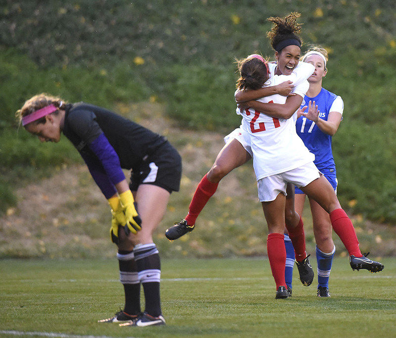 Sports - 1st place - Dayton's Ashley Campbell hugs Meghan Blank while St. Louis's goalkeeper Hanna Benben looks on. The goal set up an overtime period where the Dayton Flyers won 3-2.  (Erik Schelkun / Elsestar Images)