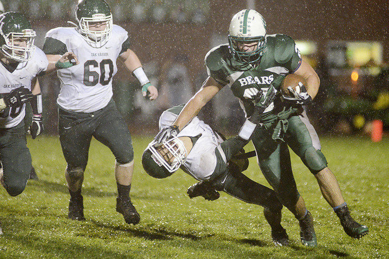 Sports - 2nd place - Margaretta's Derek Abbott pushes down Oak Harbor's Jeremy Balboa as he carries the ball. (Angela Wilhelm / Sandusky Register)