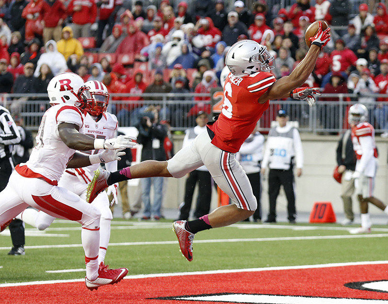 Sports - HM - Ohio State wide receiver Evan Spencer (6) makes a one-handed catch for a touchdown behind Rutgers defensive back Lorenzo Waters (21) during the third quarter at Ohio Stadium in Columbus. (Adam Cairns / The Columbus Dispatch)