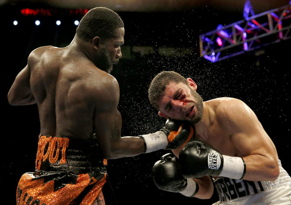 SSports - 1st place - Adrien Broner (left) lands an uppercut against Khabib Allakhveriev during their 12-round WBA super lightweight bout at US Bank Arena in Cincinnati.  (Kareem Elgazzar / The Cincinnati Enquirer)