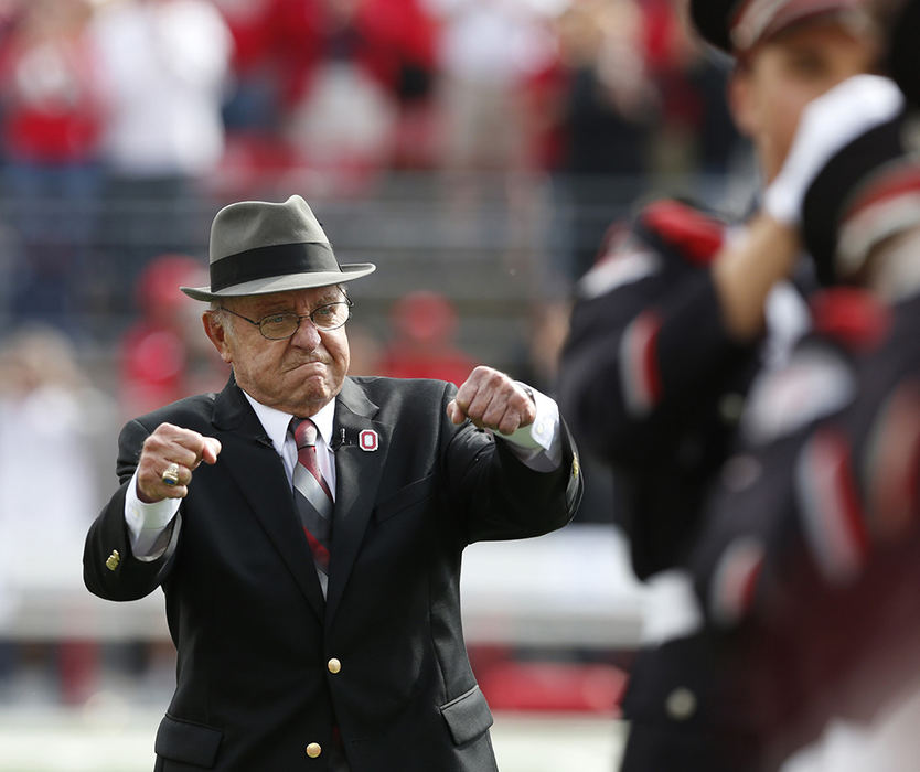 Portrait - 2nd place - Earle Bruce does fist pump after dotting the i before the OSU Rutgers game at Ohio Stadium . The longtime OSU football coach was honored during the halftime show. (Eric Albrecht / The Columbus Dispatch)