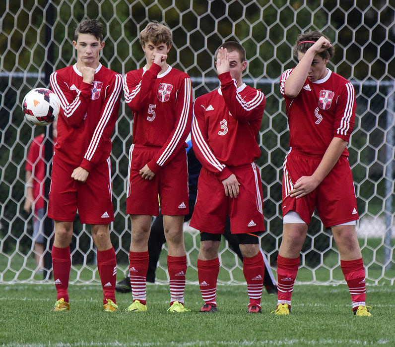 Sports Feature - 2nd place - Port Clinton's (from left) Thomas Keville, Michael Baxter, Kaleb Mizener, and Braedon Kelly form a wall as Genoa's Sean Hoeft makes a free kick. Hoeft scored on the kick as part of Genoa's 3-0 victory.  (Molly Corfman / The News-Messenger)