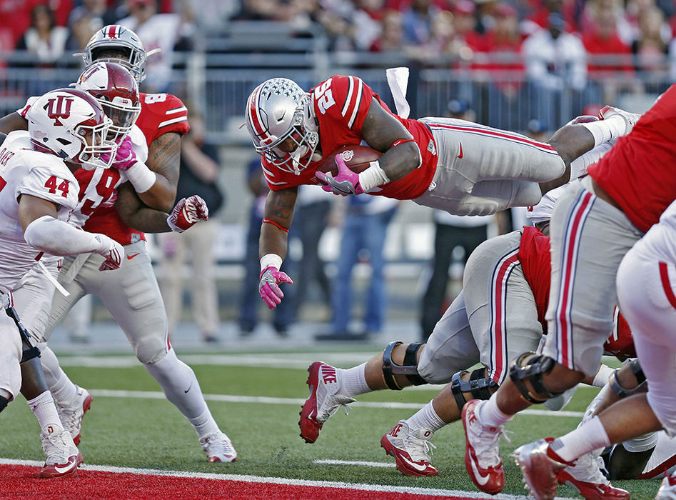 Sports - 2nd place - Ohio State running back Mike Weber (25) goes into the air to score a touchdown against Indiana Hoosiers during the second half of their game in Ohio Stadium in Columbus. (Kyle Robertson / The Columbus Dispatch)