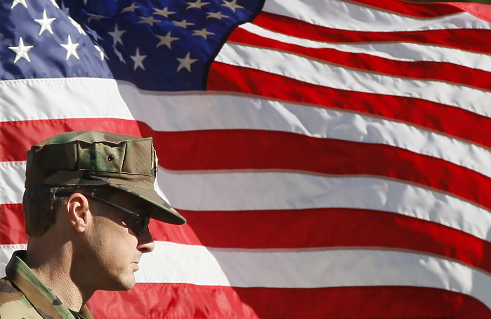 NEGeneral News - 3rd place - Brian Reed, with the Reynoldsburg VFW Color Guard, waits to be called up to present the colors during a groundbreaking ceremony for the new Reynoldsburg Community Center YMCA in Reynoldsburg. (Shane Flanigan / ThisWeek Community News)