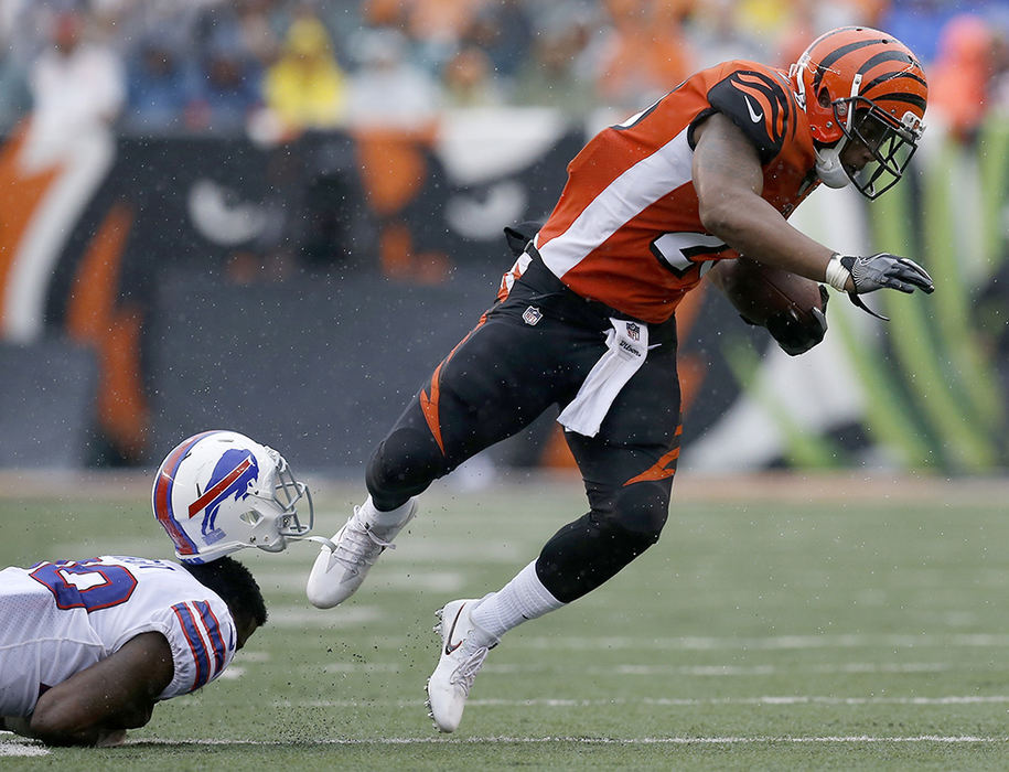 SSports - HM - Cincinnati Bengals running back Joe Mixon (28) kicks the helmet off of Buffalo Bills defensive back Shareece Wright (20) evading a tackle on a carry in the second quarter of a  game at Paul Brown Stadium in Cincinnati on Oct. 8. (Sam Greene / Cincinnati Enquirer)