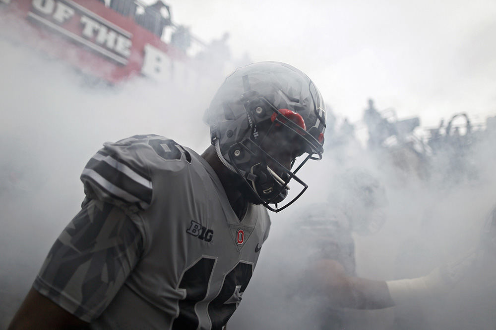 Story - 1st place - Ohio State quarterback J.T. Barrett (16) enters the field before the start of their game against Penn State Nittany Lions in Ohio Stadium in Columbus. (Kyle Robertson / The Columbus Dispatch)