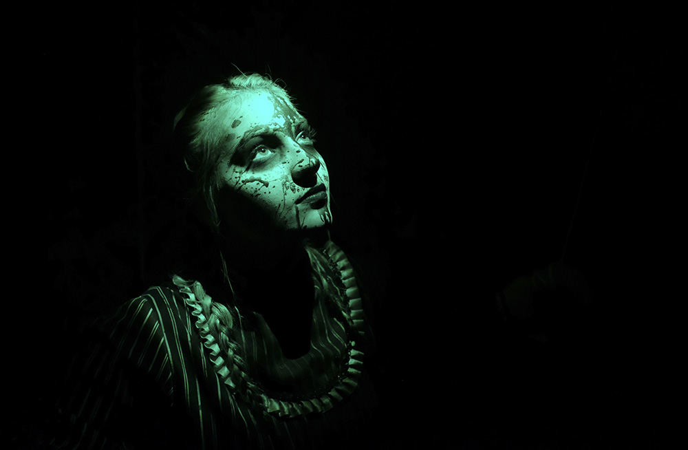    Story - 3rd place - Emily Valiton of Toledo dressed as a scary puppet scares people at the Distracted Haunted House in Perrysburg. (Jeremy Wadsworth / The Blade)