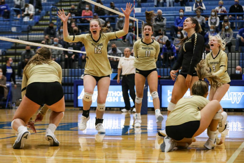 Sports Feature - 1st place - Perrysburg's celebrates their 3-2 win against Antony Wayne in the Division I volleyball district semifinal at Anthony Wayne High School in Whitehouse. Rebecca Benson / The Blade