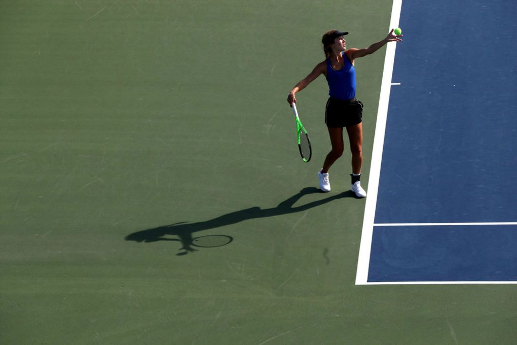 Sports - HM - Olentangy's Sydney Nickel serves the ball in a doubles match against Cincinnati Ursuline Academy during the Division I state tennis tournament at Lindner Family Tennis Center in Mason. Shane Flanigan / ThisWeek Community News