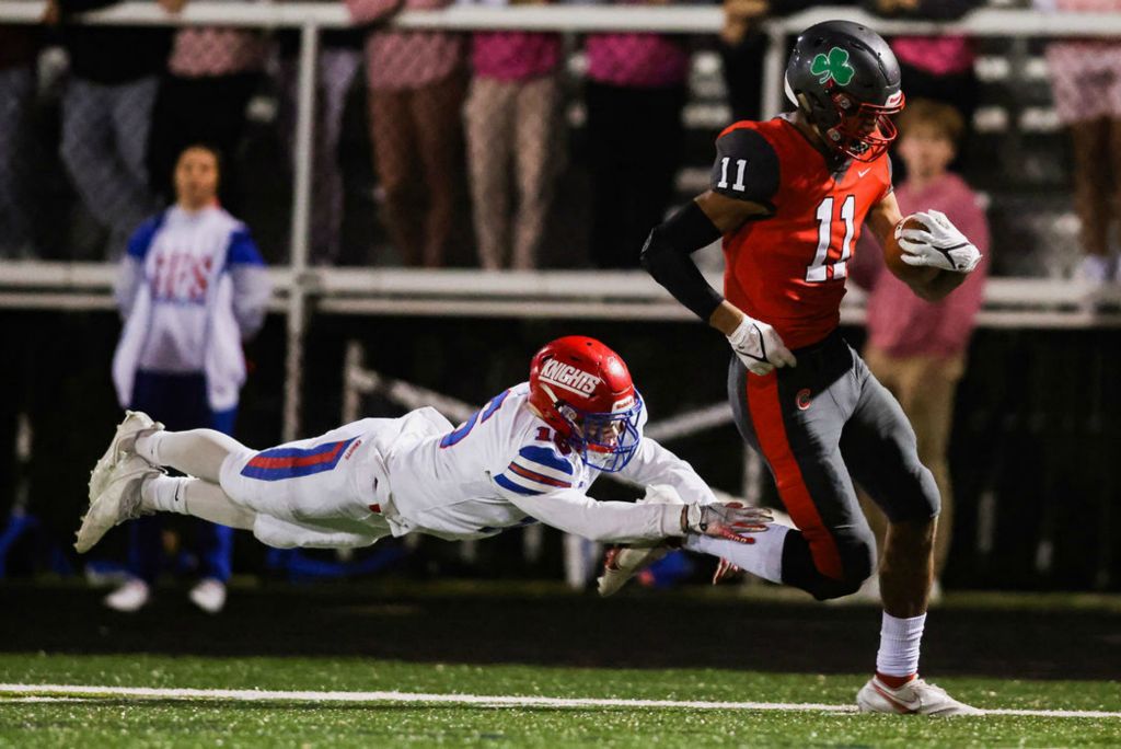 Sports - 3rd place - Central Catholic’s Sam Lee (right) runs to the end zone as St. Francis de Sales’ Alex Shaffer tries to bring him down during a game at Central Catholic High School in Toledo. (Rebecca Benson / The Blade) 