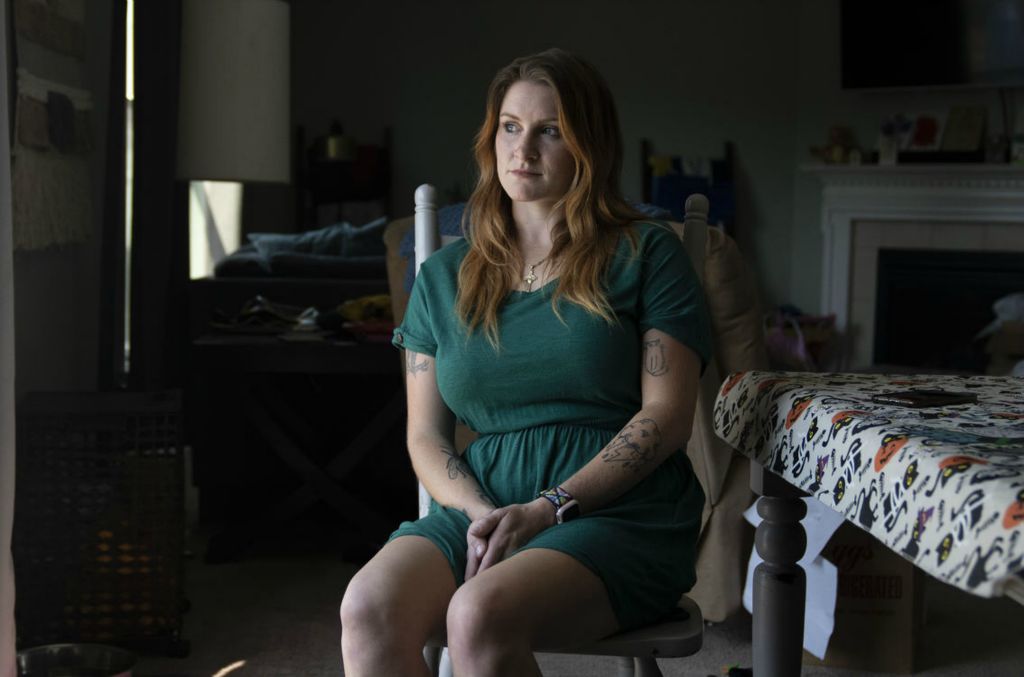 Portrait - 1st place - Lana Hiott sits in the kitchen of her home in Marysville, Ohio. Hiott’s sister Shannon Hiott was murdered by her former partner in her home last month.  (Brooke LaValley / The Columbus Dispatch)